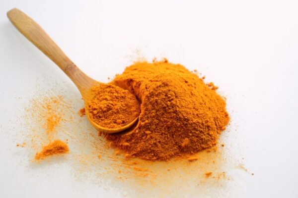 Illustrative Turmeric powder photograph, not actual Naativa Ruchi packaging