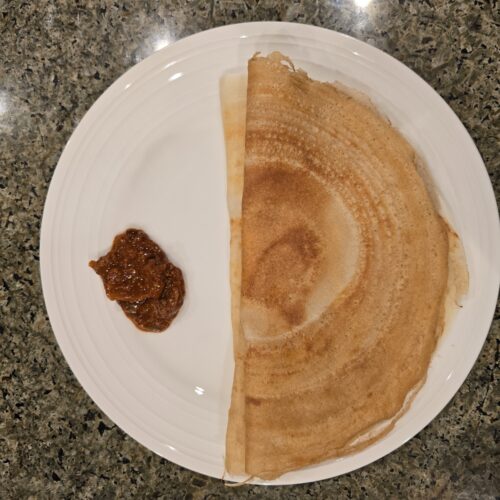 Illustrative Dosa serving photograph, not actual Naativa Ruchi packaging
